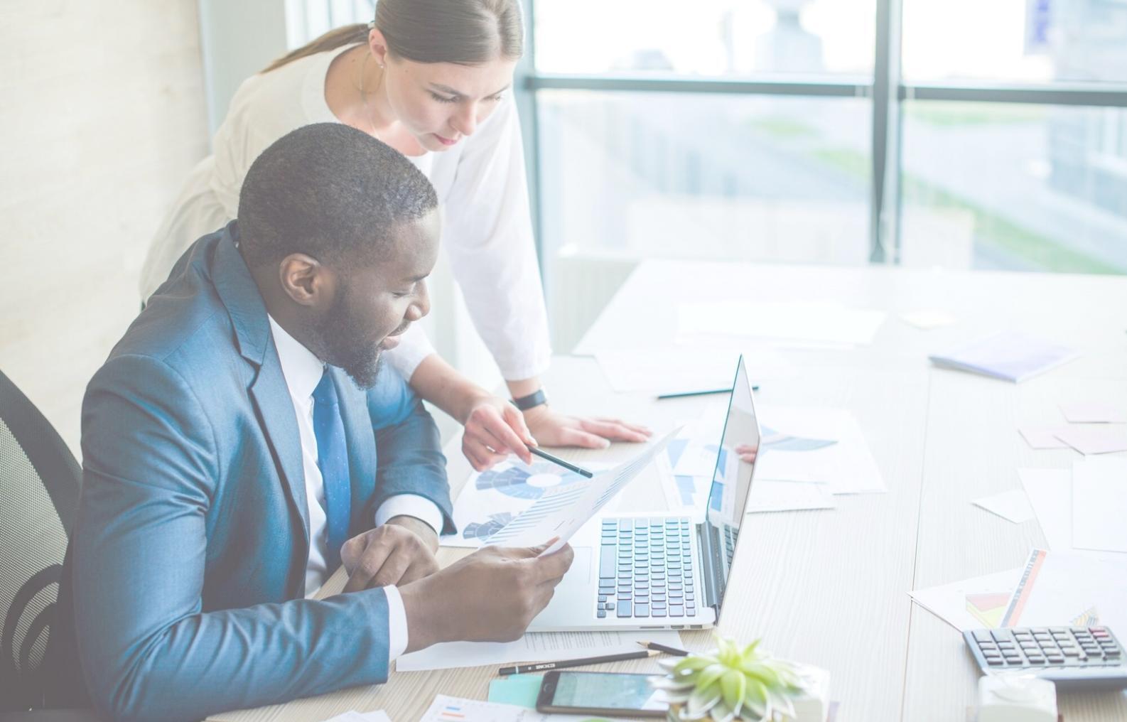 Financial analysis workspace with industry reports and data visualizations